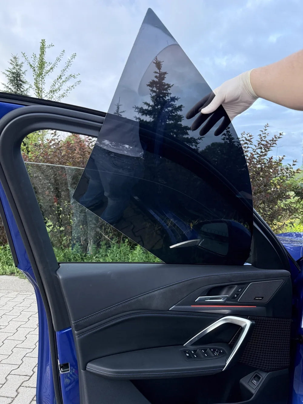 Sliding a tint panel behind the window seal