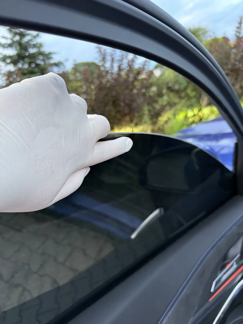 Pressing down the top edge of a fitted panel