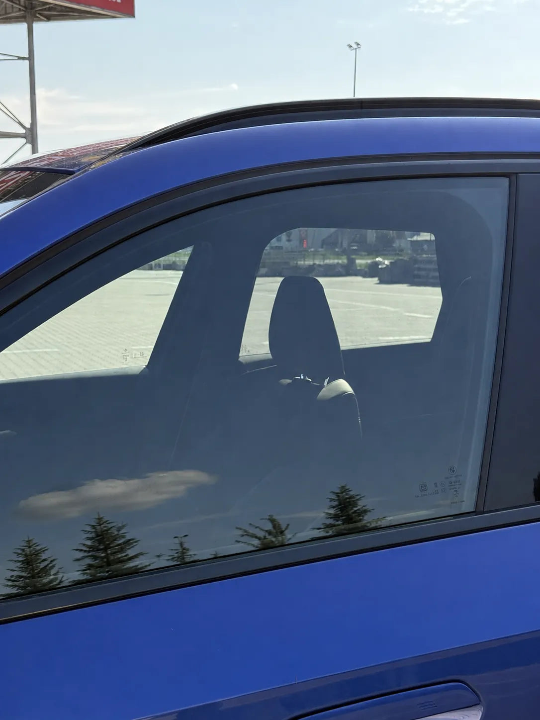 The same car before fitting — windows without tint panels